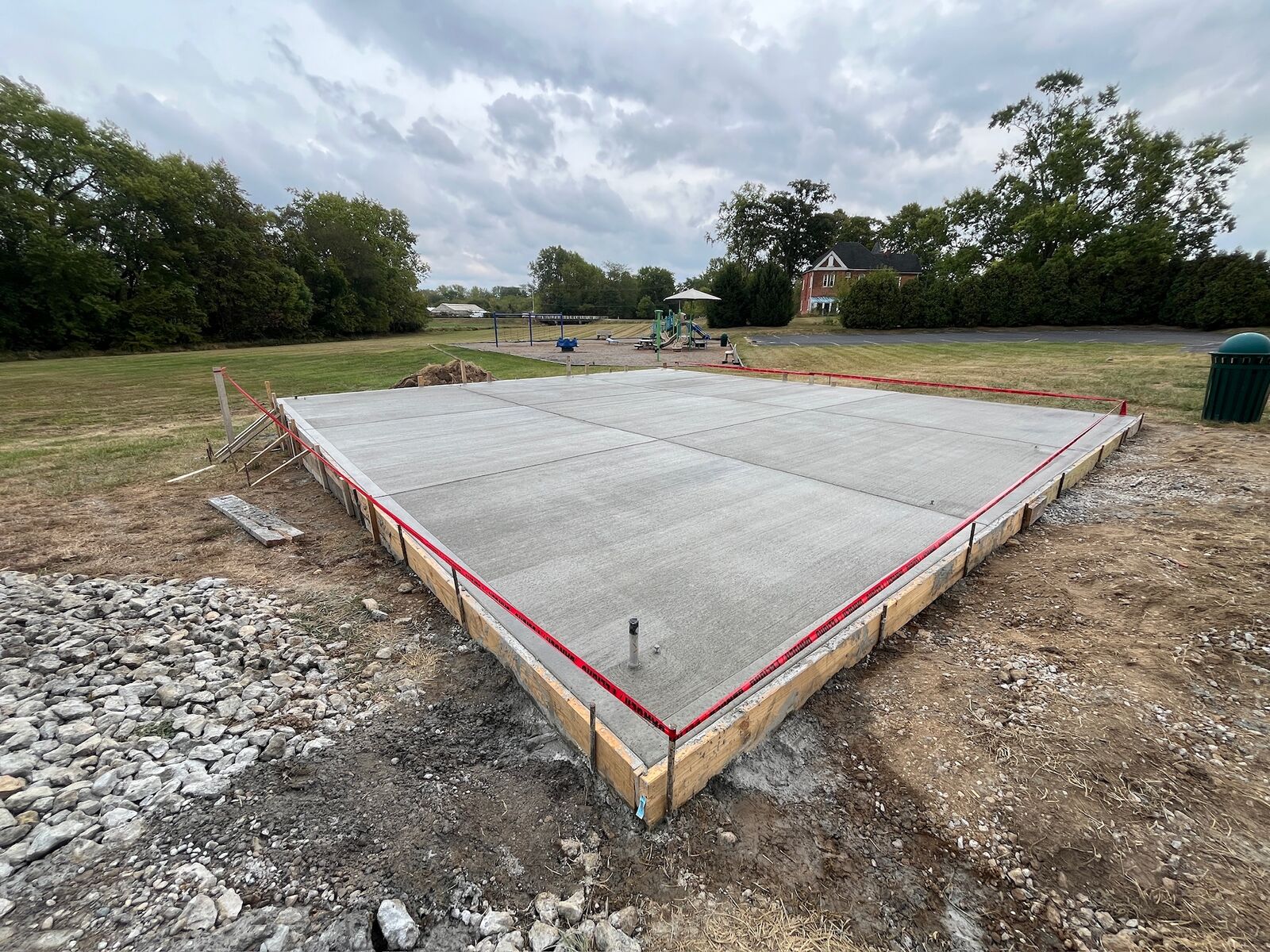 Finished concrete slab with saw-cut joints inside forms