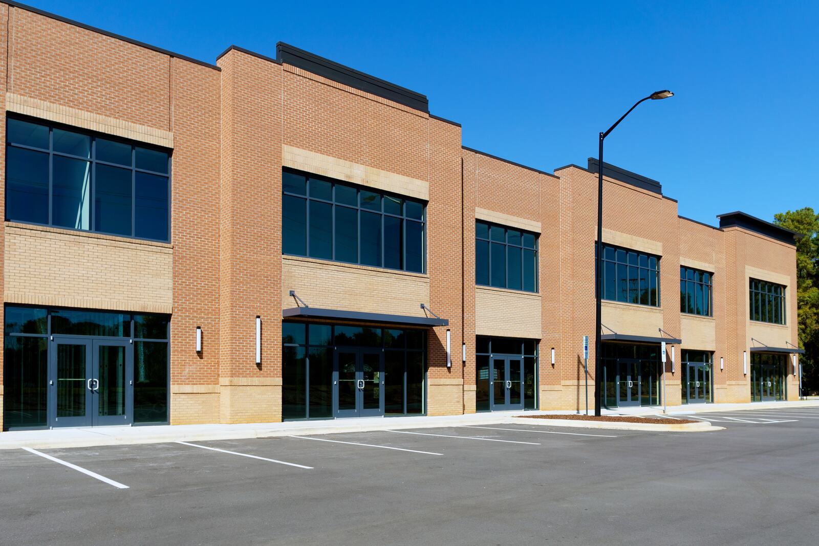 New two-story brick commercial building with storefront entrances