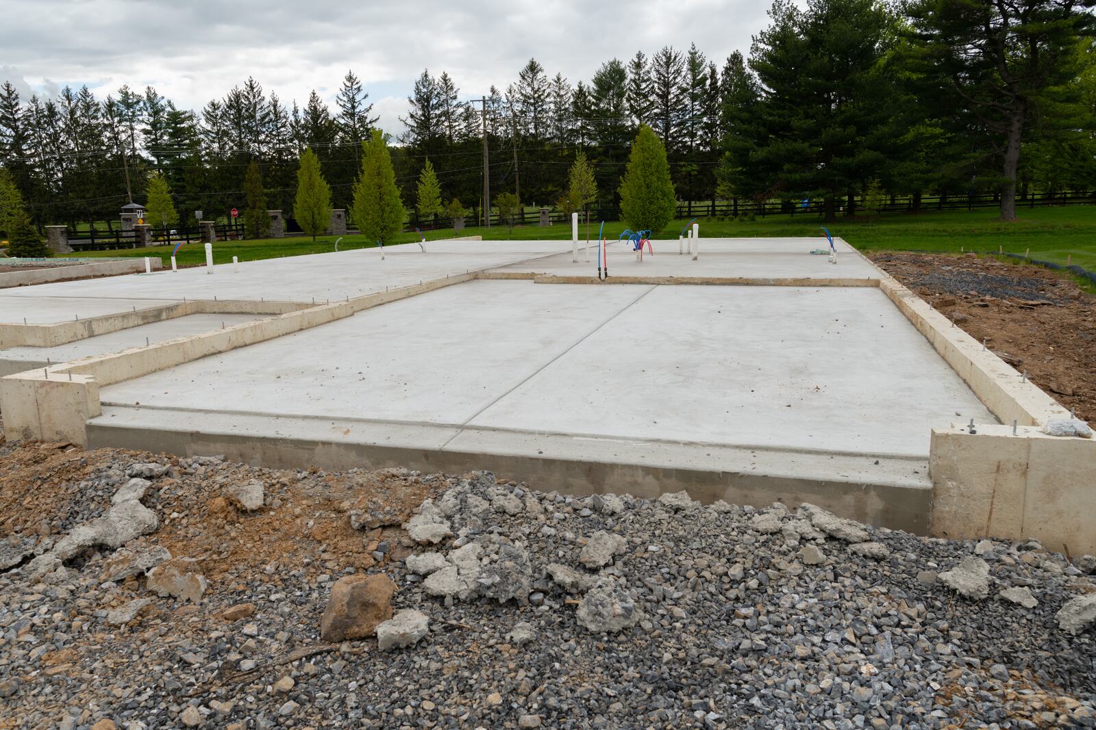 Concrete slab on grade with footings and utility stub-outs